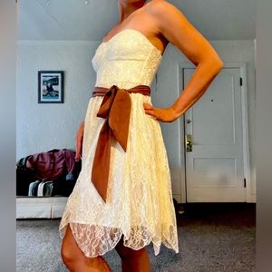 Brand new creme laced heart bodice dress with mauve tie.